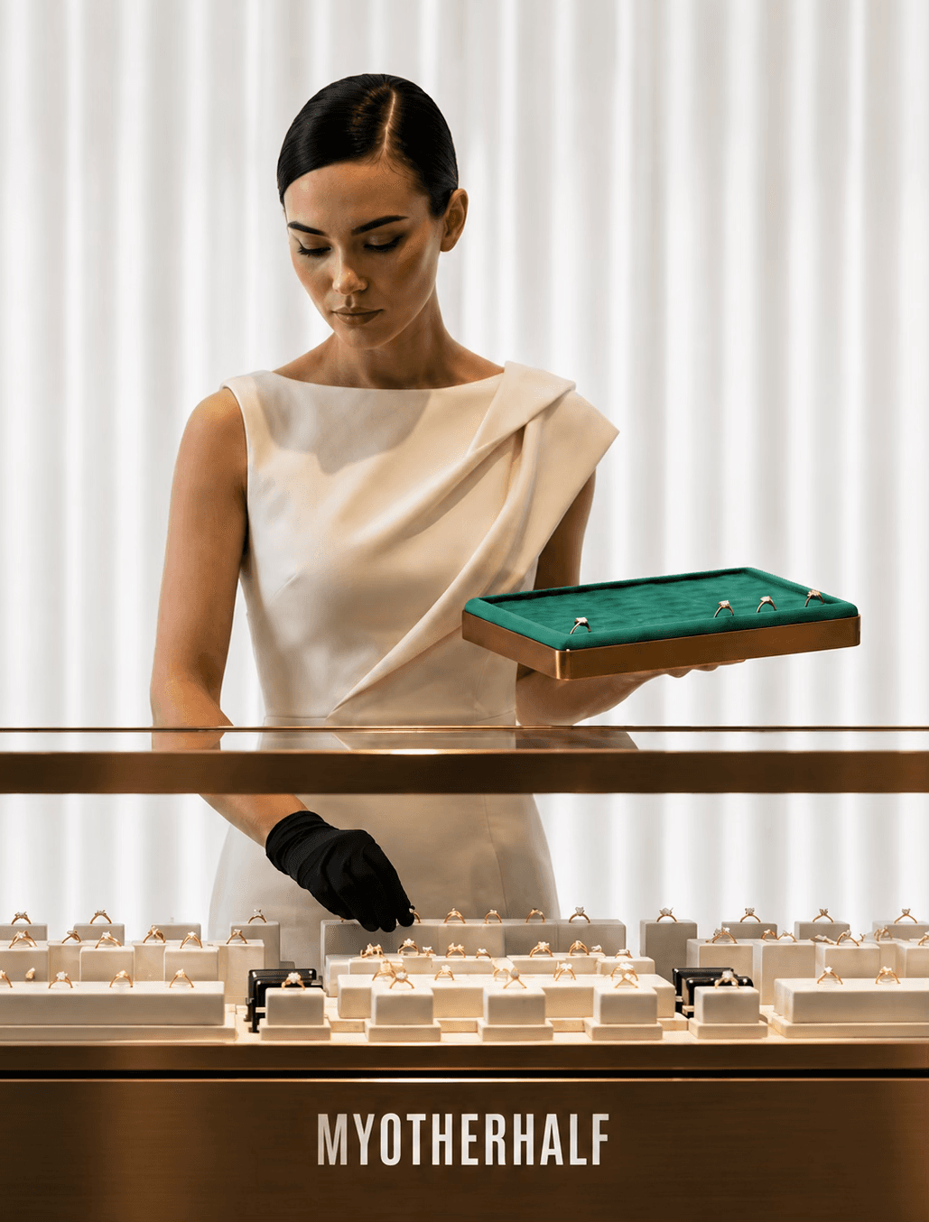 MOH London showroom consultant presenting a tray of engagement rings