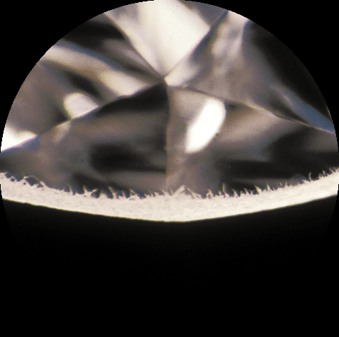 Indented natural along the girdle under magnification