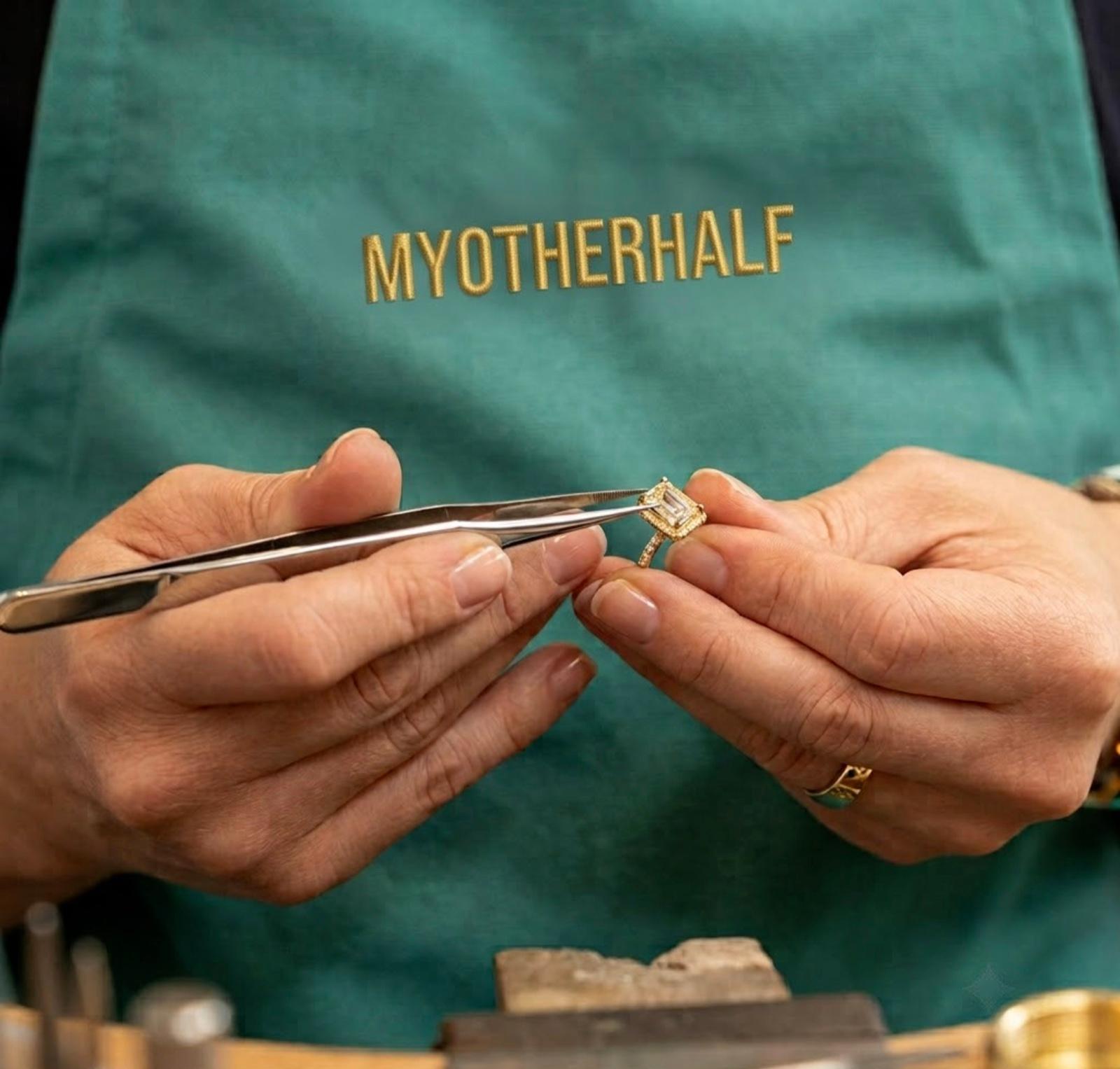 Master craftsman’s hands setting a diamond into a bespoke engagement ring