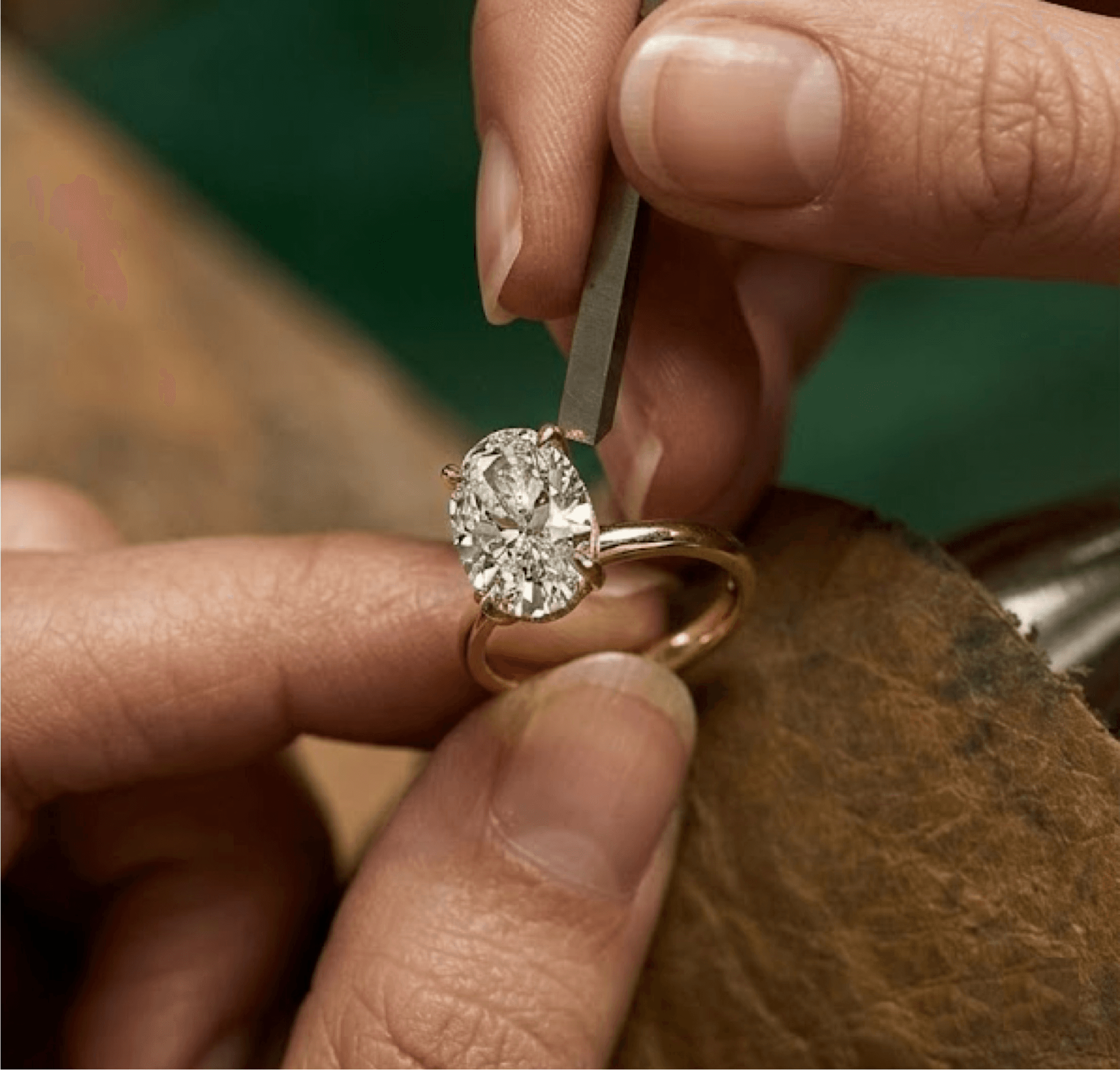 Master jeweller hand-setting an oval diamond at the MOH London workshop