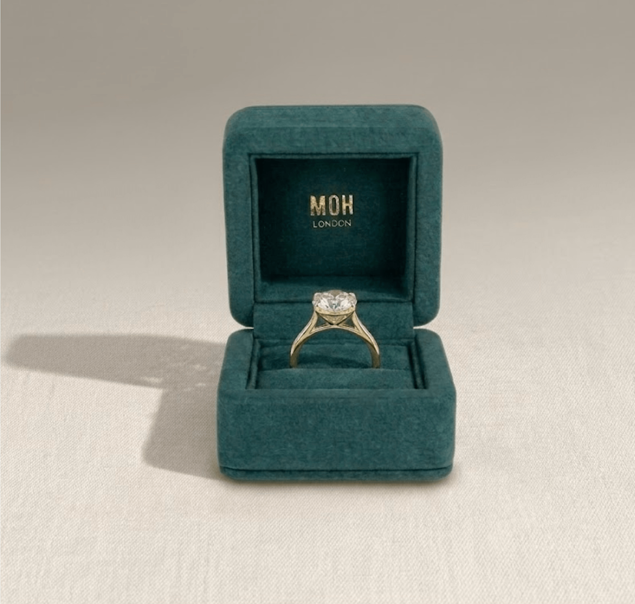 Diamond ring presented in signature MOH teal ring box