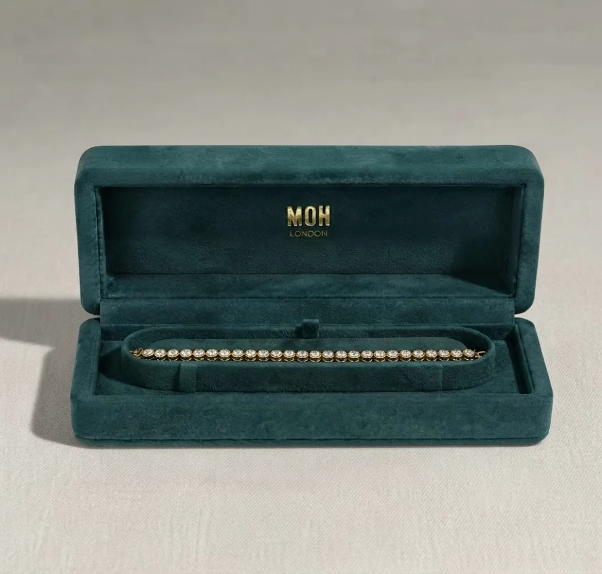 Diamond tennis bracelet in MOH London teal presentation box