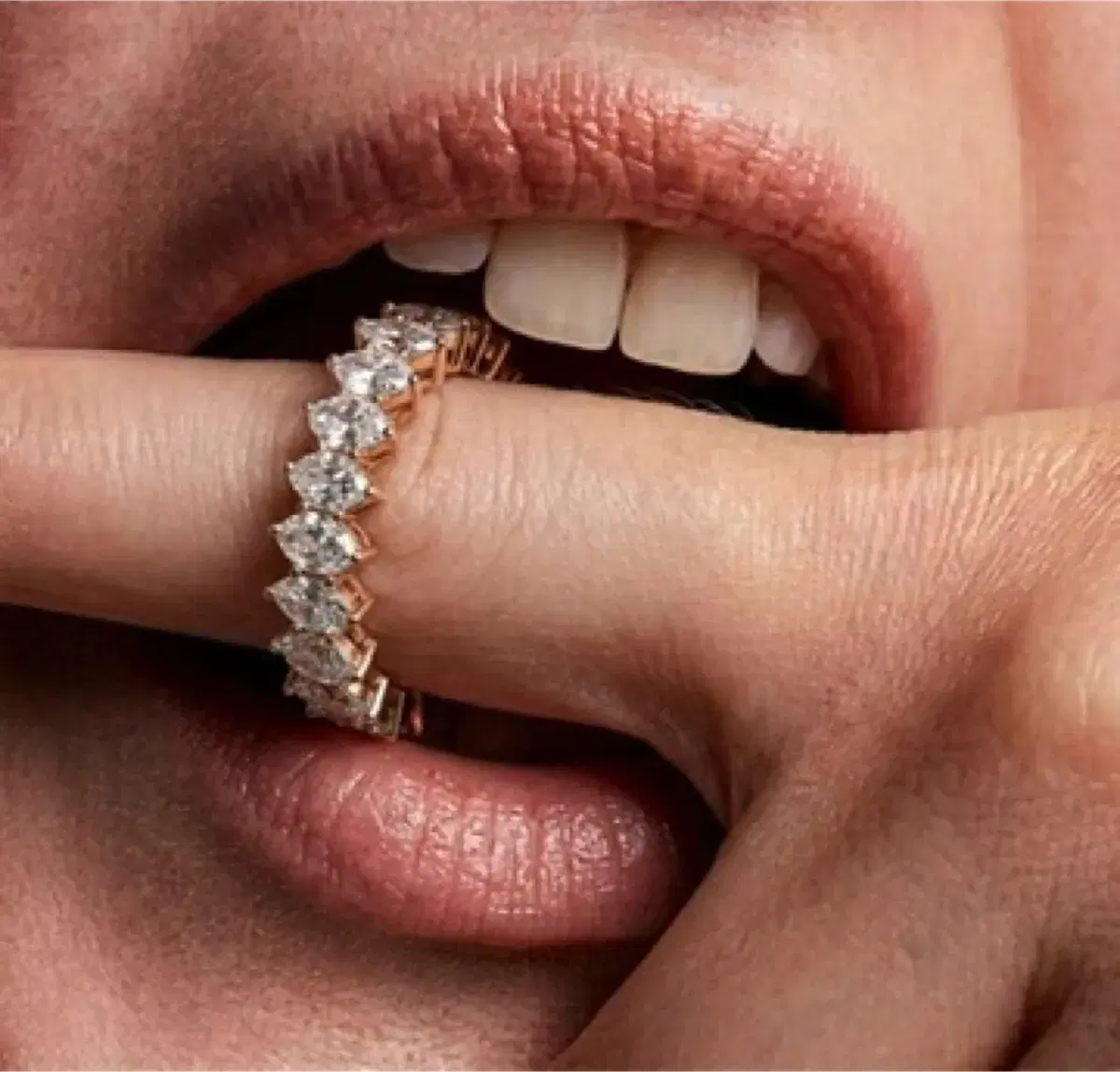 Marquise diamond eternity ring on finger — editorial close-up